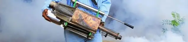 Fumigation technician using a fogger for deep pest treatment in Sterling Heights, MI
